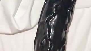 Squirting on a huge dildo