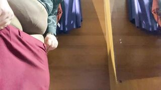 Curvy MILF in the mall fitting room trying on skirts