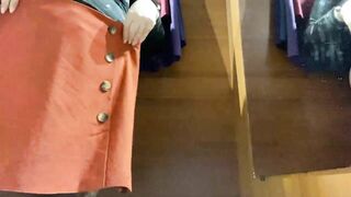 Curvy MILF in the mall fitting room trying on skirts