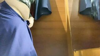 Curvy MILF in the mall fitting room trying on skirts