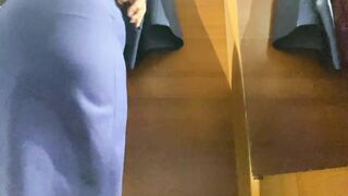 Curvy MILF in the mall fitting room trying on skirts