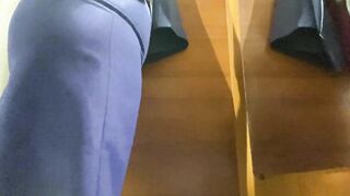 Curvy MILF in the mall fitting room trying on skirts