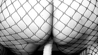 LiaKahn Spanish milf fucks her dildo dressed in a fishnet bodysuit