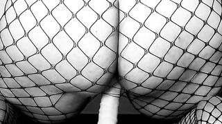 LiaKahn Spanish milf fucks her dildo dressed in a fishnet bodysuit