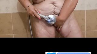 Ugly fat granny with mask takes a shower. Her saggy titts are amazing.