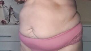 Ugly Fat Grandmother slowly reveales her naked body. Her large breasts will make you hard.