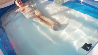 Elegant and flexible babe, swimming underwater in the outdoor swimming pool. 2 2