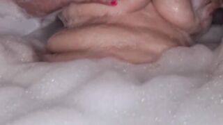 Granny BBW Lady takes a bath and shows big boobs and ass.