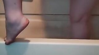 Bunny plays with holes in the bathroom