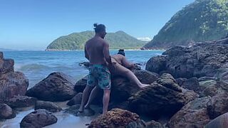 Big-tailed wife in a thong having sex on the beach