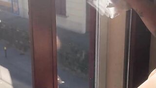 Exhibitionist wife cleaning windows topless. Sexy milf flashing boobs on window. Flashing neighbors