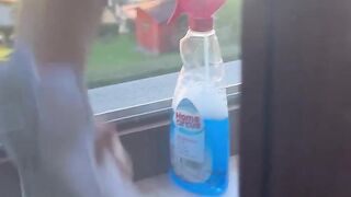 Exhibitionist wife cleaning windows topless. Sexy milf flashing boobs on window. Flashing neighbors