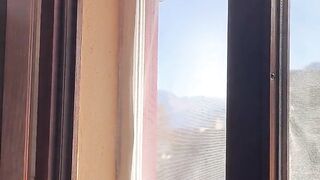 Exhibitionist wife cleaning windows topless. Sexy milf flashing boobs on window. Flashing neighbors