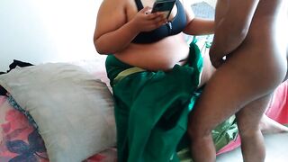 Telugu aunty in green saree with Huge Boobs on bed and fucks neighbor while watching porn on mobile