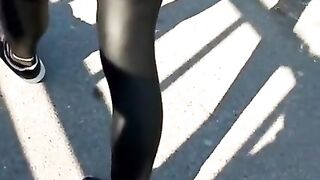 Some slut walking in leather leggings!!