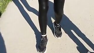 Some slut walking in leather leggings!!