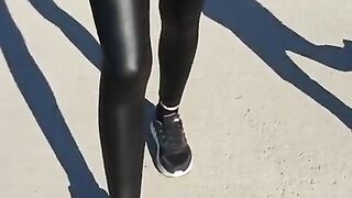 Some slut walking in leather leggings!!