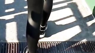 Some slut walking in leather leggings!!