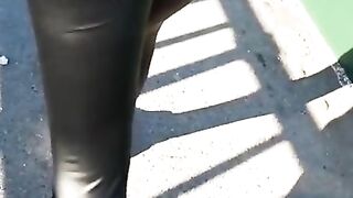 Some slut walking in leather leggings!!