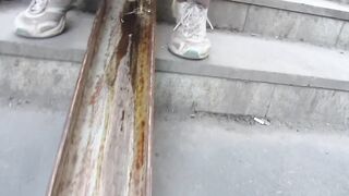 Mature Milfs Pissing on the Stairs of Public Transition