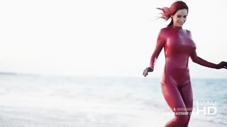 Sexy Red Latex Catsuit on the Beach