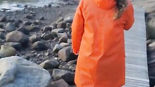 Taking a Stroll in Orange Raincoat and Rubber Boots