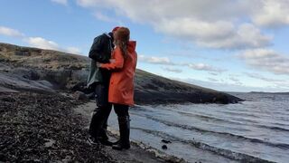 Cuddling in Rainwear on the Beach