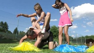 After the two angry cheerleaders have wrestled their stupid couch down, they smother him with their panties.