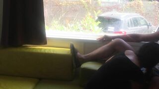 Wife giving risky blowjob in front of window in a camper van