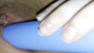 Shy white girl plays with toy vibrator