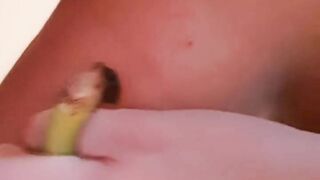 Fucks herself with banana pussy and ass