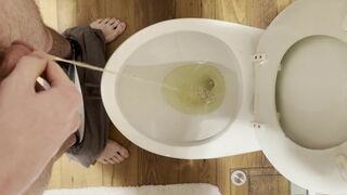 Master Justin Pisses in Toilet