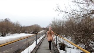 Naked girl walking on the bridge