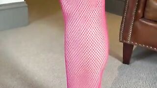 Pink bodystocking and heels