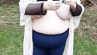 BBW bouncing fat tits in the woods