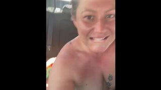 Freckled thick amateur pawg Jez sits in the back of a truck naked on the highway