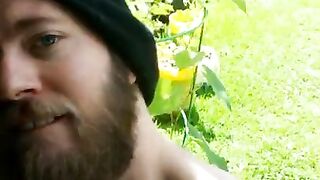 Bearded guy stroking outside