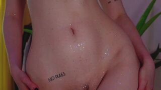 Purple hair teen puts glitter on naked body