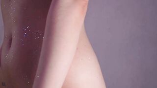 Purple hair teen puts glitter on naked body