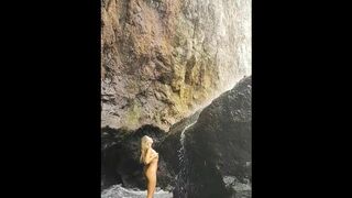 Naked beautiful girl under waterfall. Home video. Nudist wife.