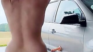 Nude outside in the rain and fucking dildo on car