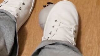 Rubbing his cock with white shoes