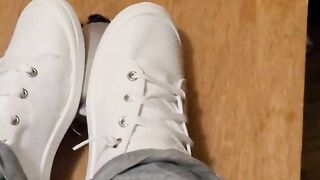 Rubbing his cock with white shoes