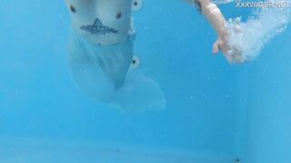 Finnish blonde tattooed pornstar Mimi underwater