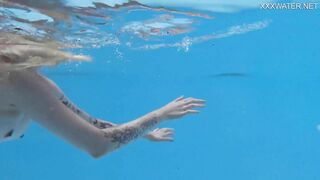 Finnish blonde tattooed pornstar Mimi underwater