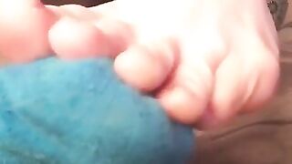 Toe wiggling in thin blue socks