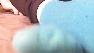 Toe wiggling in thin blue socks