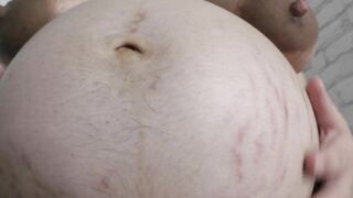 Cheating wife Milky Mari with a big pregnant belly showing to you her shaved pussy close up  with a huge clit!