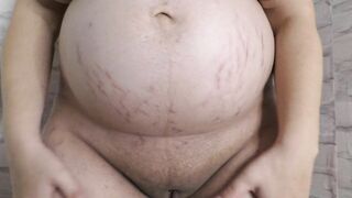 Cheating wife Milky Mari with a big pregnant belly showing to you her shaved pussy close up  with a huge clit!